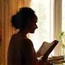 Lucy Omondi reading at Willow & Thorn's sunny window seat