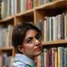 Rachel Hopkins browsing book shelves at Willow & Thorn